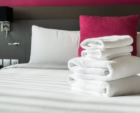 White towel on bed decoration in bedroom interior